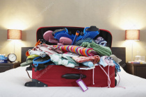 Depositphotos 33865097-stock-photo-open-suitcase-on-bed.jpg