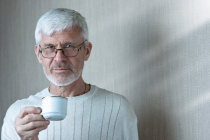 Portrait-of-gray-haired-man-holding-a-cup-of-coffee 105538-305.jpg