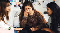 Teenage-girls-consoling-their-depressed-crying-P9H2NAF-715x400.jpg