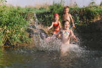 Little-girls-smiling-playing-river.jpg